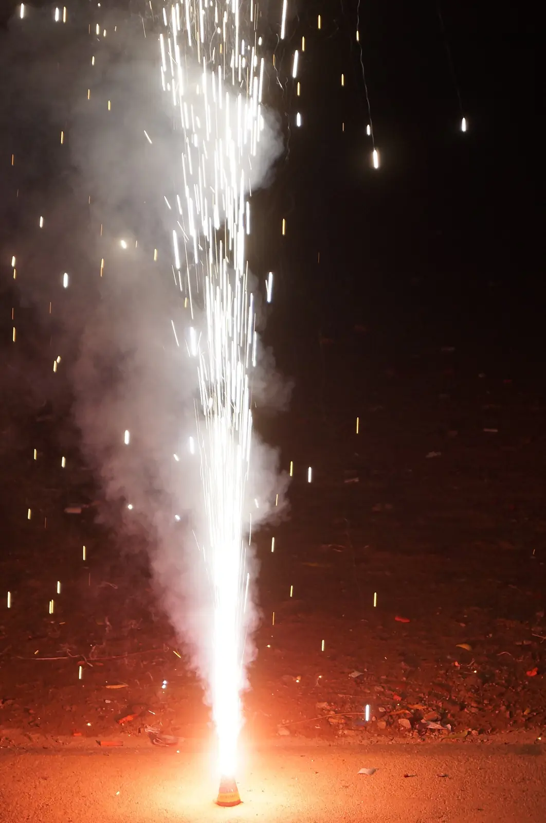 A flower pot fountaining sparks